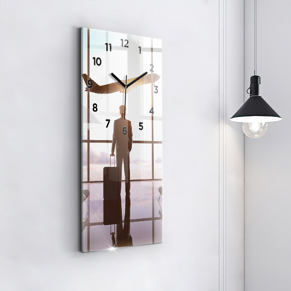 Modern vertical wall clock Man at the airport