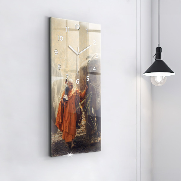 Modern vertical wall clock Monk leading elephants
