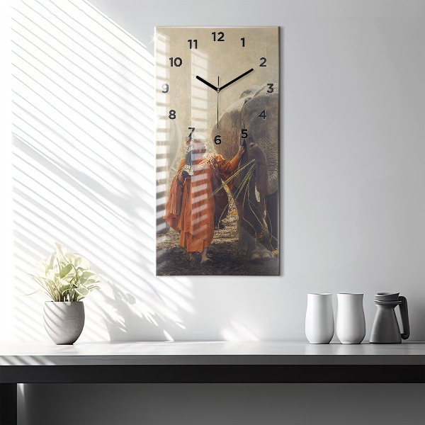 Modern vertical wall clock Monk leading elephants