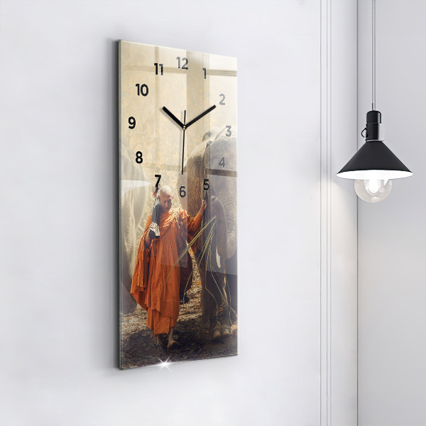 Modern vertical wall clock Monk leading elephants