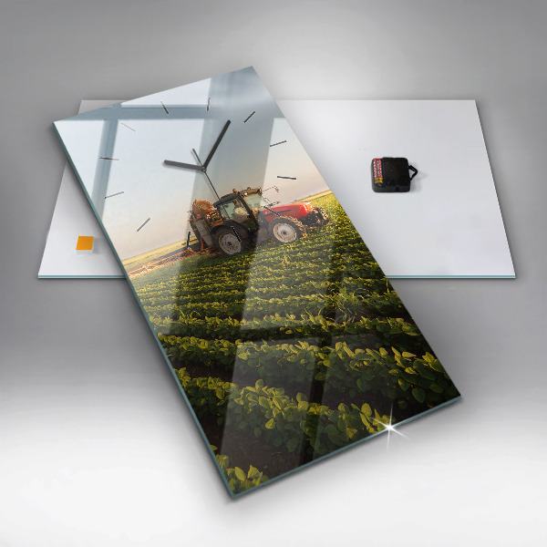 Modern vertical wall clock Tractor in a farm field