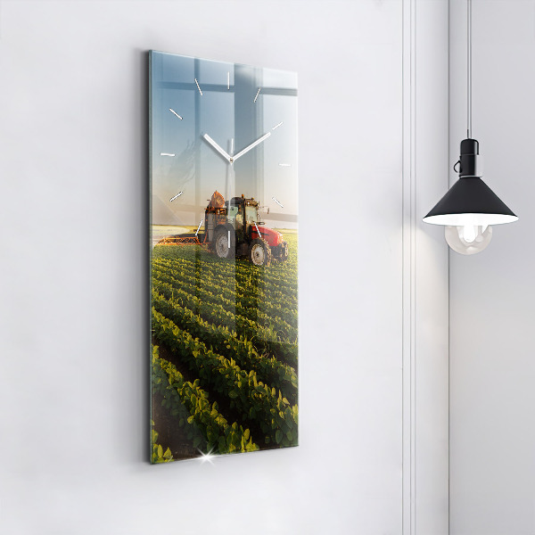 Modern vertical wall clock Tractor in a farm field