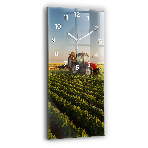 Modern vertical wall clock Tractor in a farm field
