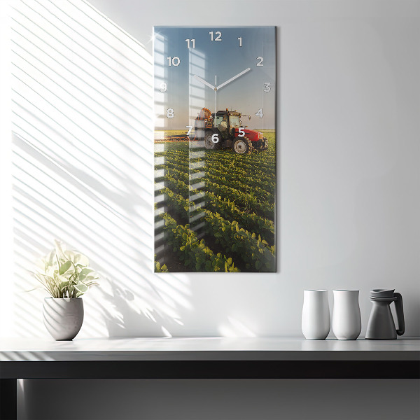Modern vertical wall clock Tractor in a farm field