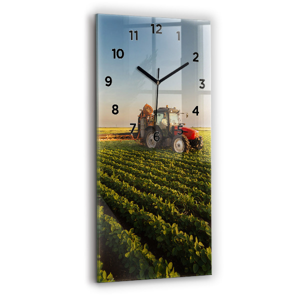 Modern vertical wall clock Tractor in a farm field
