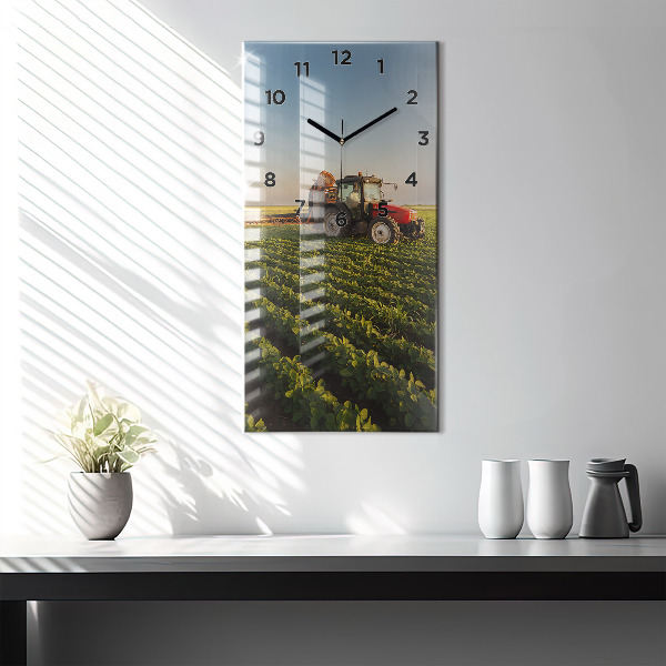 Modern vertical wall clock Tractor in a farm field