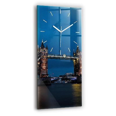 Modern vertical wall clock Tower Bridge London at night