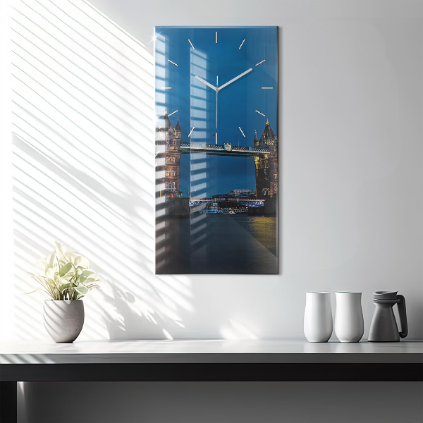 Modern vertical wall clock Tower Bridge London at night