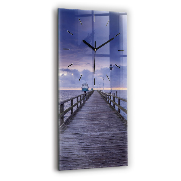 Modern vertical wall clock Pier on the Baltic Sea