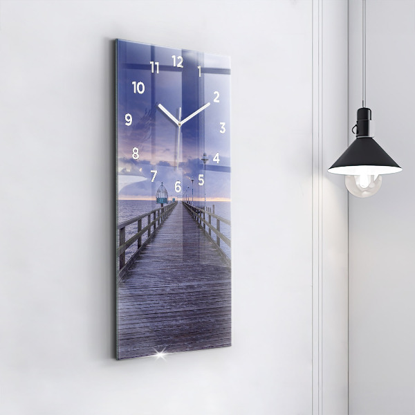 Modern vertical wall clock Pier on the Baltic Sea