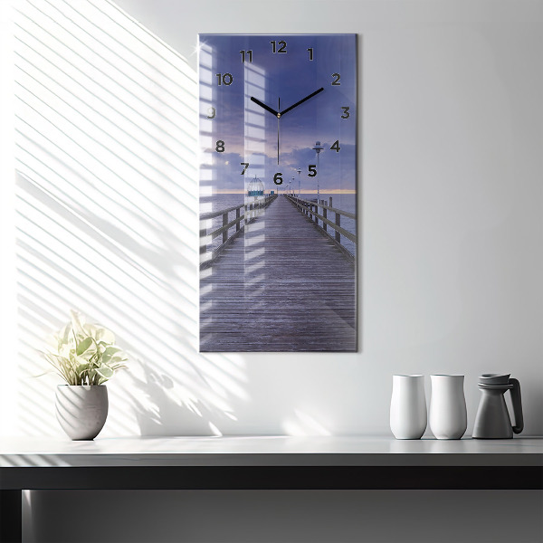 Modern vertical wall clock Pier on the Baltic Sea