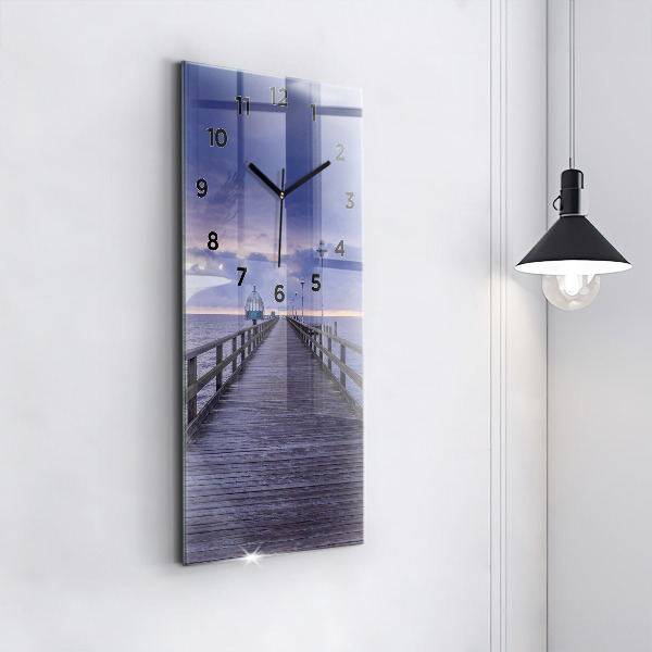Modern vertical wall clock Pier on the Baltic Sea