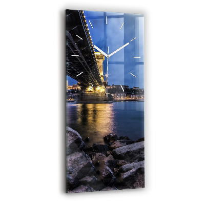Modern vertical wall clock Rocky shore under the bridge