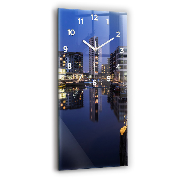 Modern vertical wall clock The city lit up at night