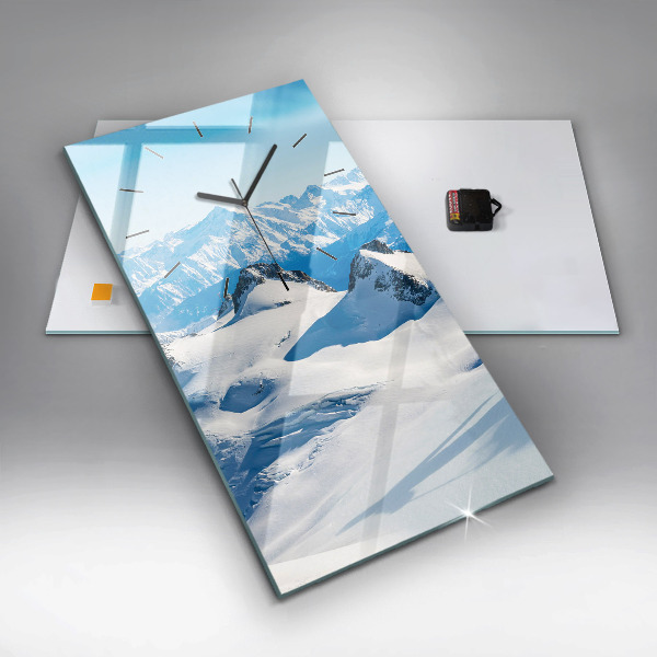 Modern vertical wall clock Skier in the Alps
