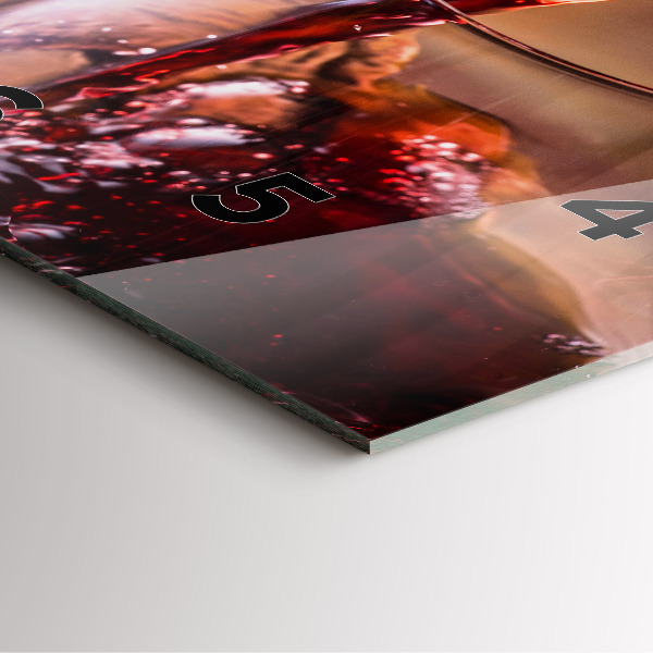 Square glass wall clock A glass of red wine