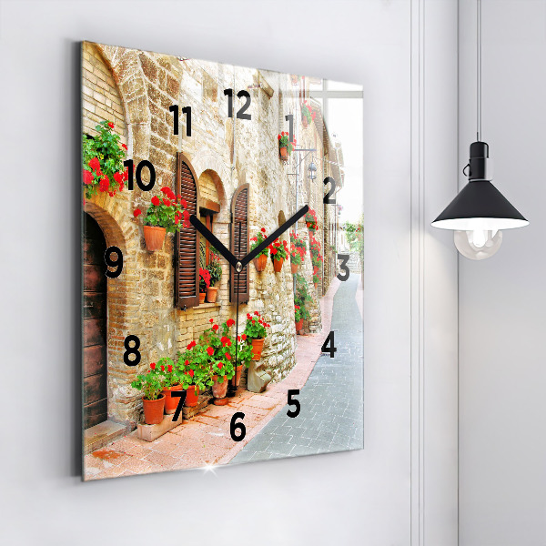 Square glass wall clock A picturesque street