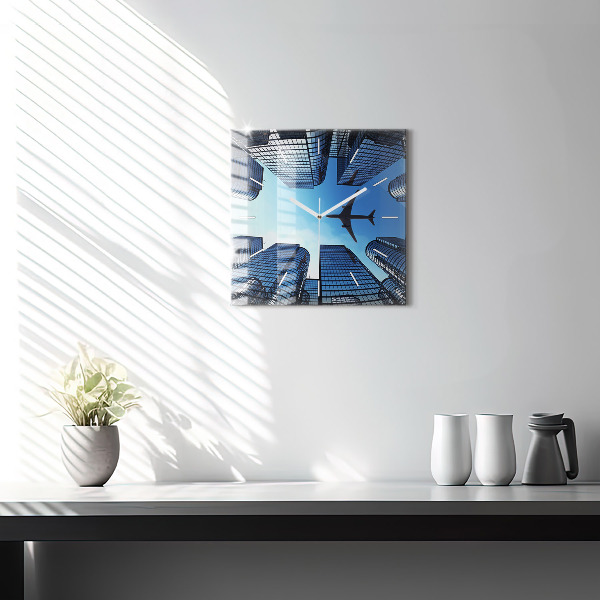 Square glass wall clock Airplane over buildings
