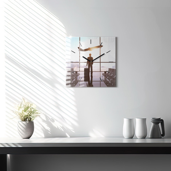 Square glass wall clock Man at the airport