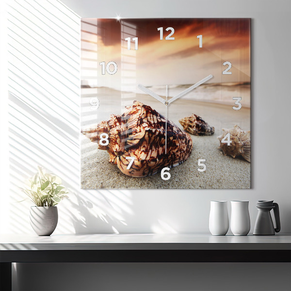 Square glass wall clock A shell on the beach