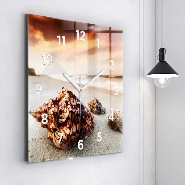 Square glass wall clock A shell on the beach