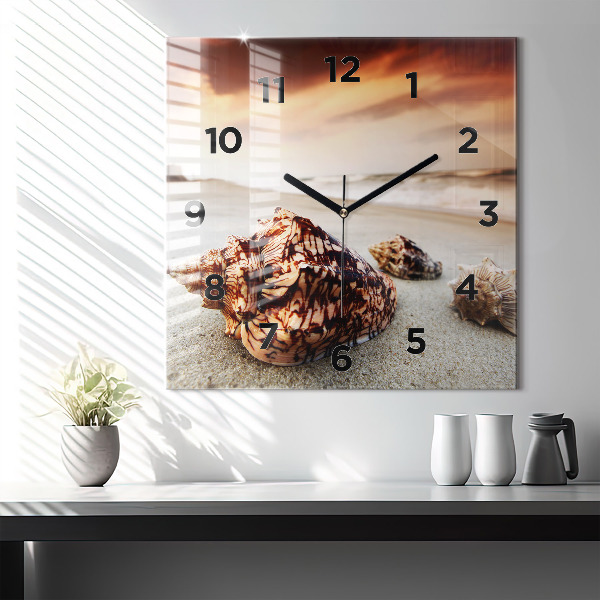 Square glass wall clock A shell on the beach