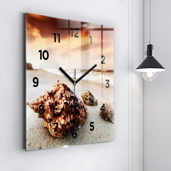 Square glass wall clock A shell on the beach
