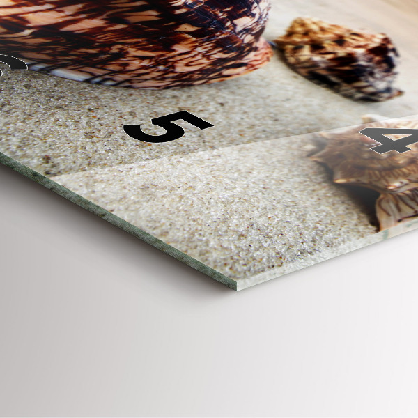 Square glass wall clock A shell on the beach