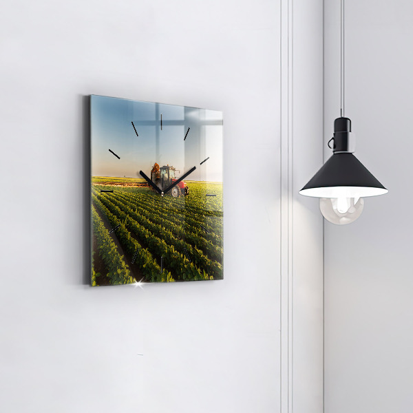 Square glass wall clock Tractor in a farm field