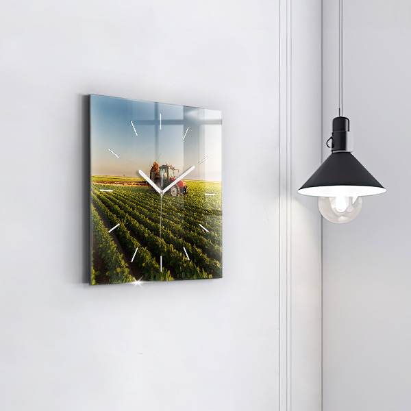Square glass wall clock Tractor in a farm field