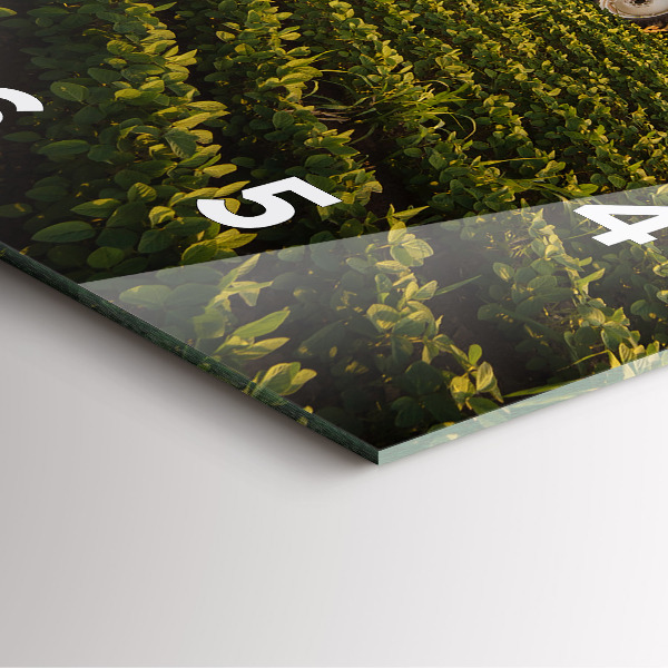 Square glass wall clock Tractor in a farm field