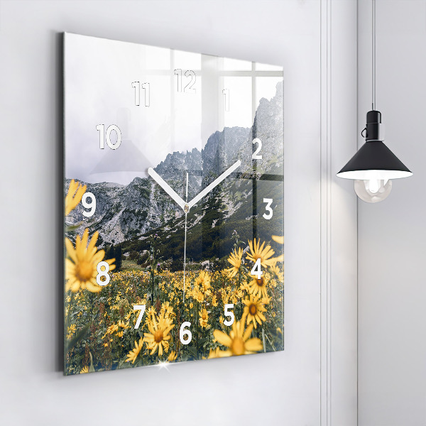 Square glass wall clock Meadow flowers in the mountains
