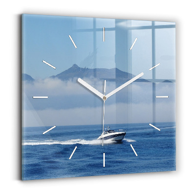 Square glass wall clock A boat floating on the ocean