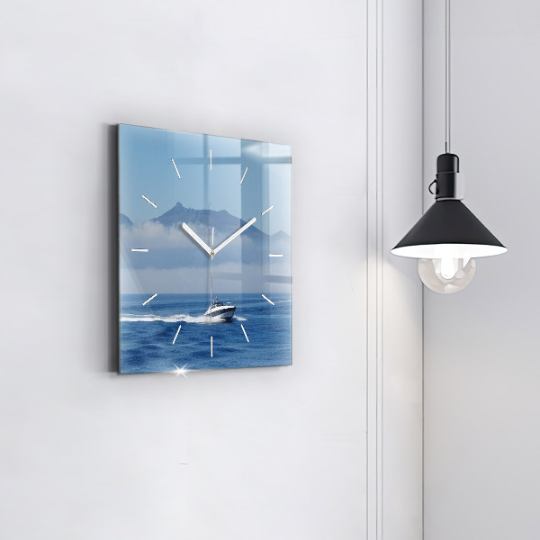Square glass wall clock A boat floating on the ocean
