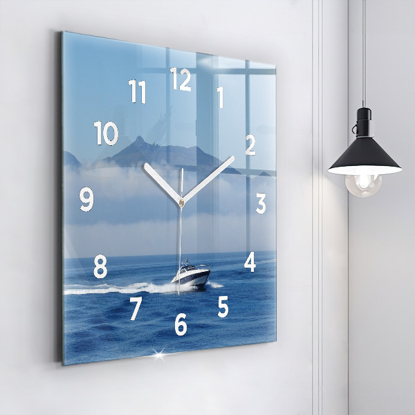 Square glass wall clock A boat floating on the ocean