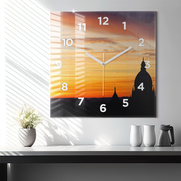 Square glass wall clock Building and sunset