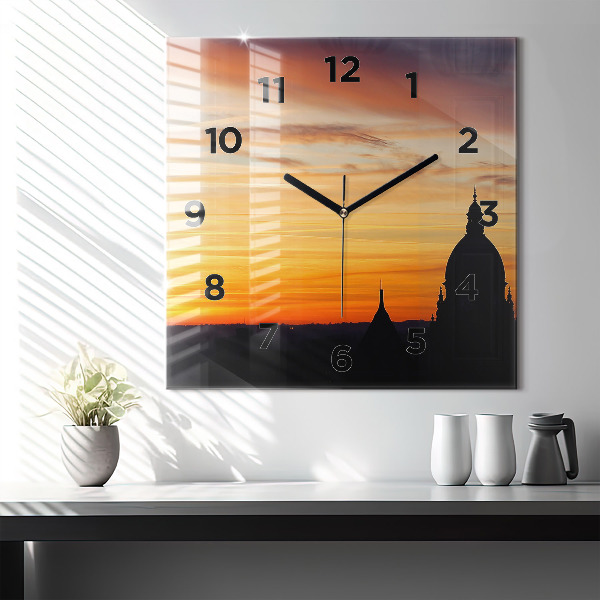 Square glass wall clock Building and sunset