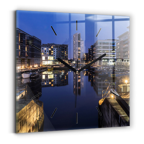 Square glass wall clock The city lit up at night
