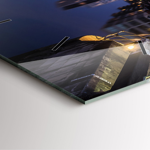 Square glass wall clock The city lit up at night