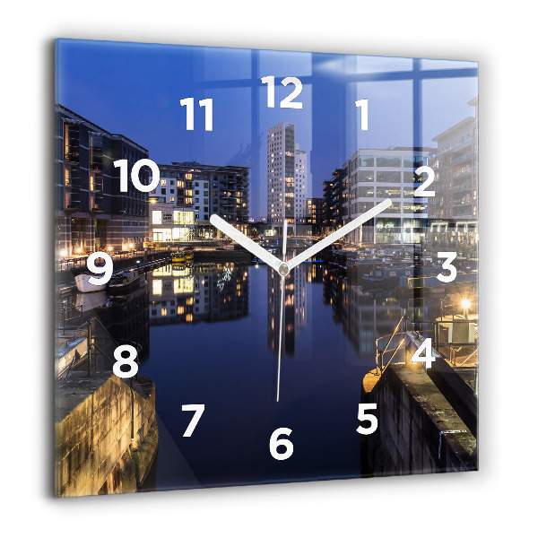 Square glass wall clock The city lit up at night