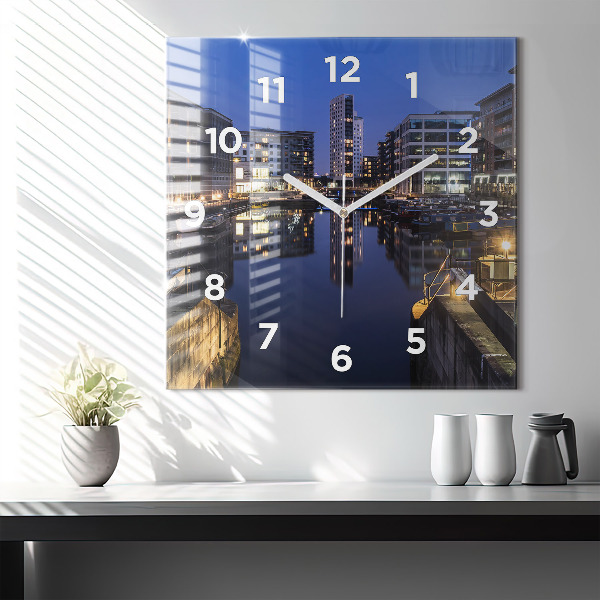 Square glass wall clock The city lit up at night
