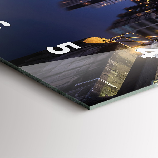 Square glass wall clock The city lit up at night