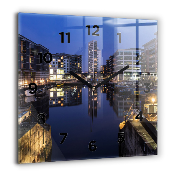 Square glass wall clock The city lit up at night