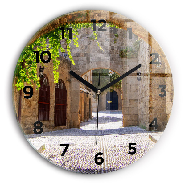 Round glass clock Picturesque street of Rhodes