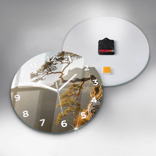 Round glass clock A tree in the mountains