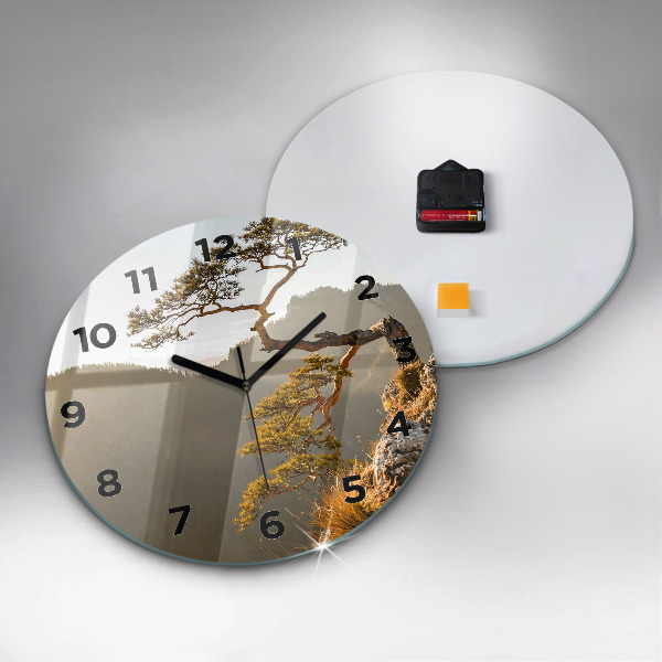 Round glass clock A tree in the mountains