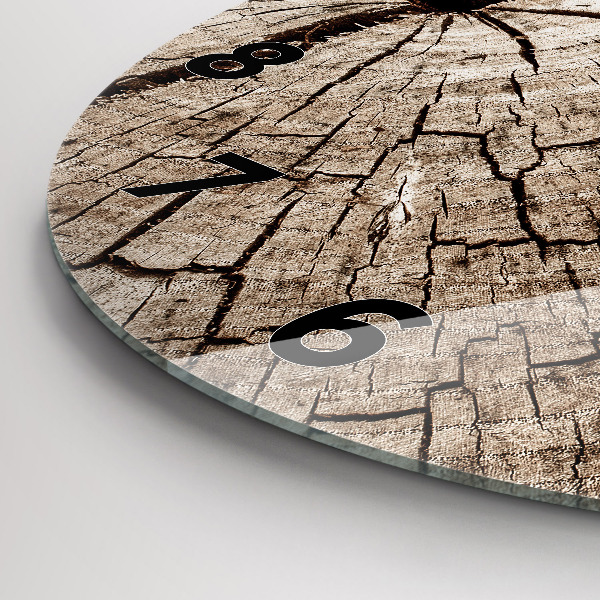 Round glass clock Old wood stump