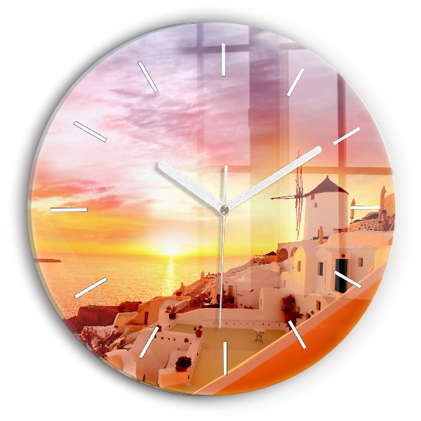 Round glass clock Old windmill in Santorini