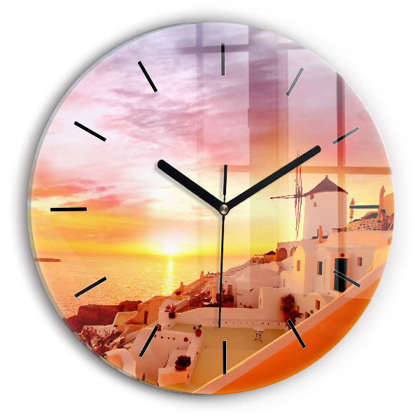 Round glass clock Old windmill in Santorini