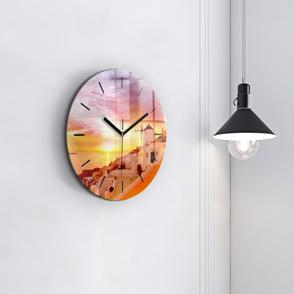 Round glass clock Old windmill in Santorini